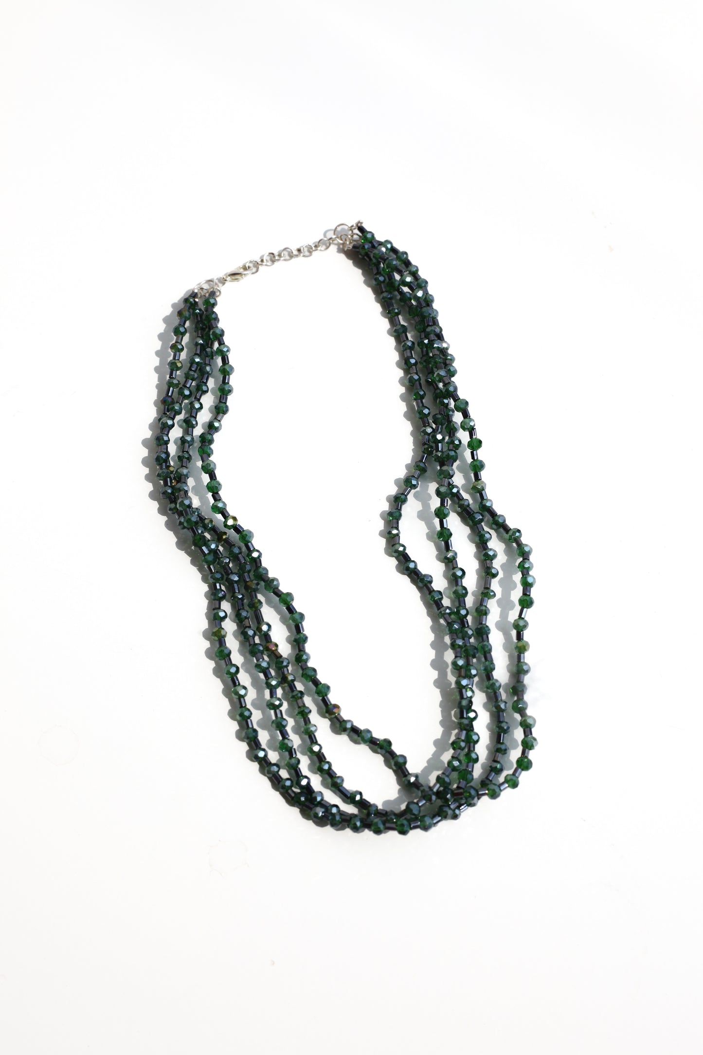 Multistrand beaded necklace on a white background