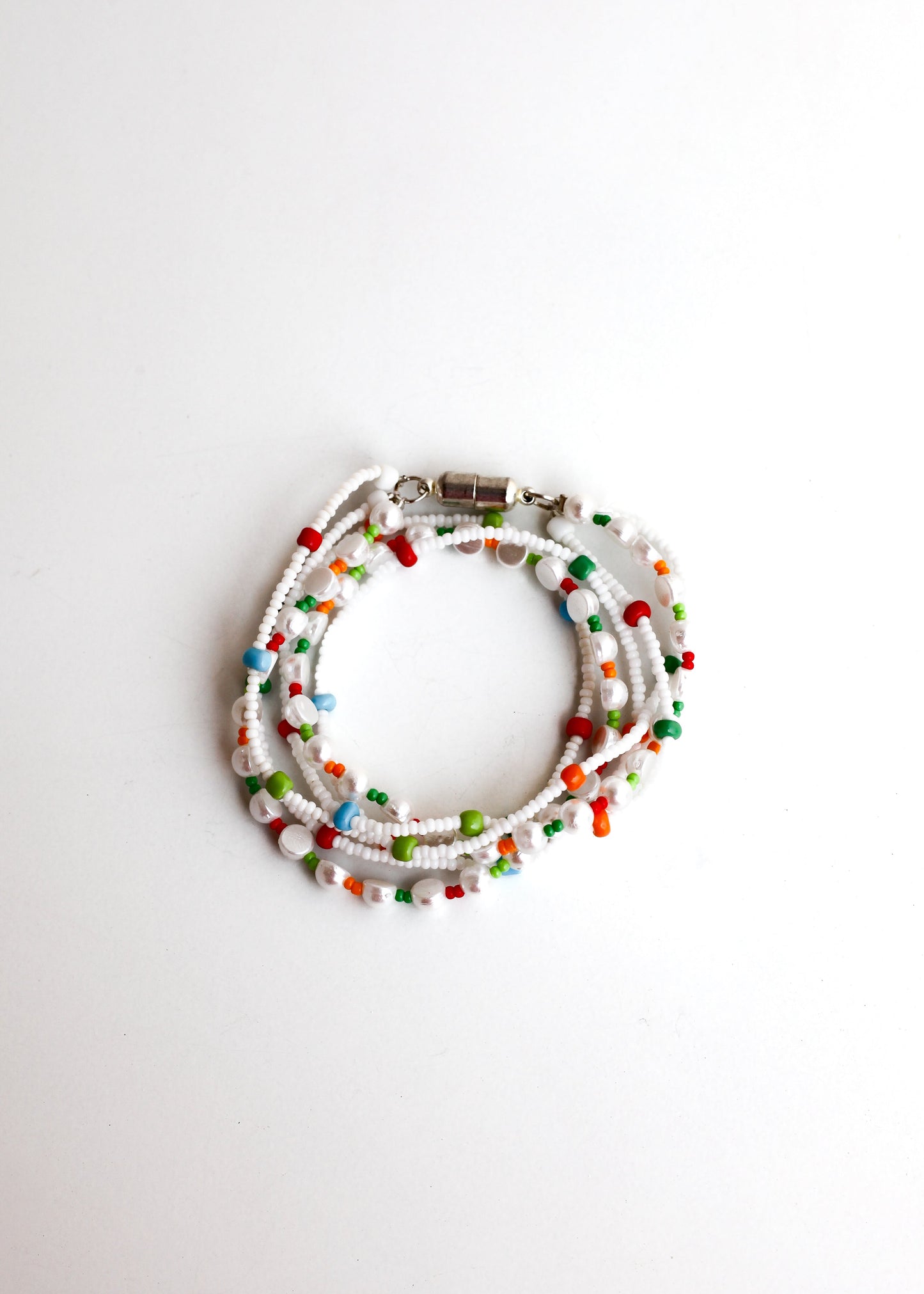 Multicolored beaded bracelet on a white background