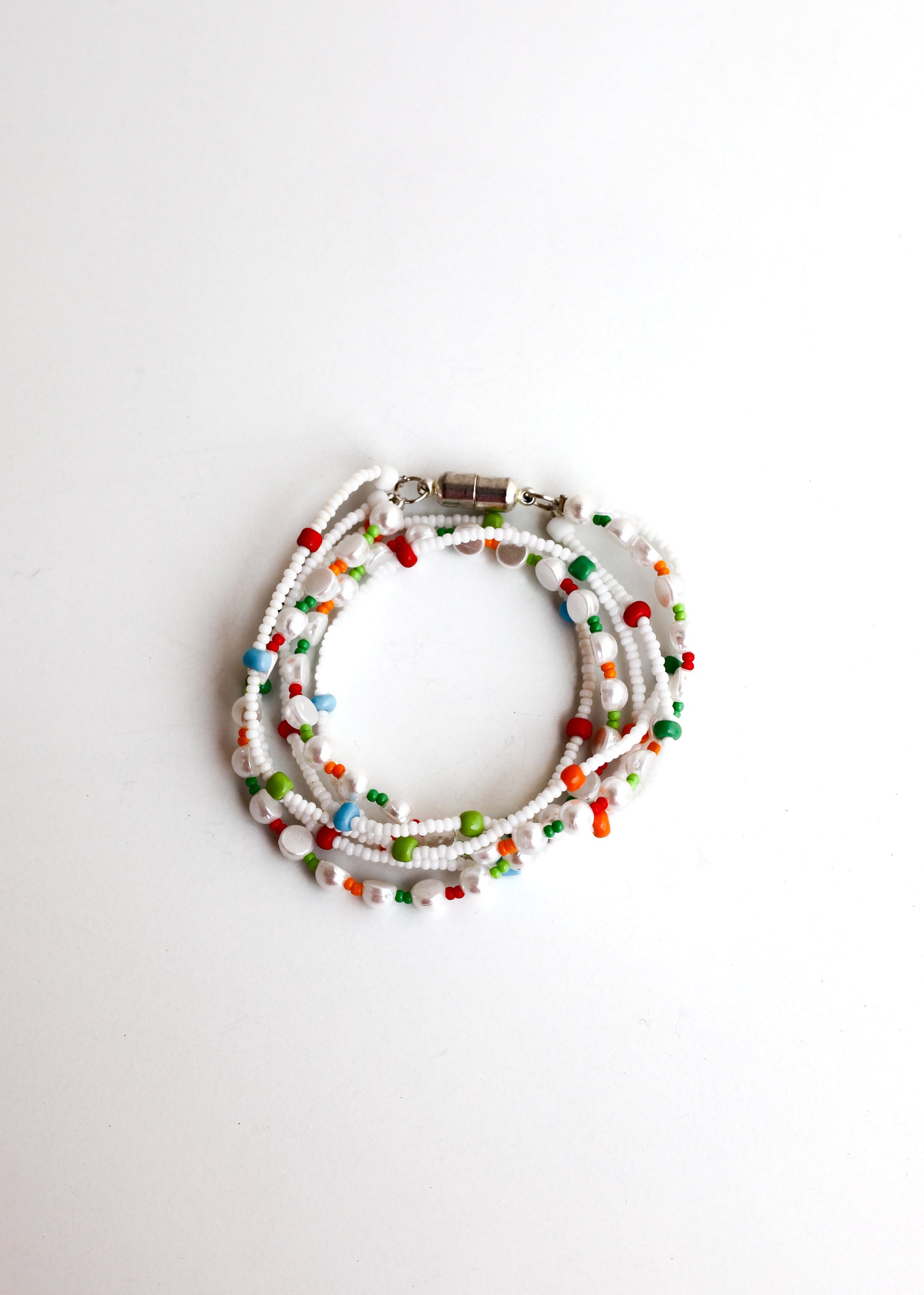 Multicolored beaded bracelet on a white background