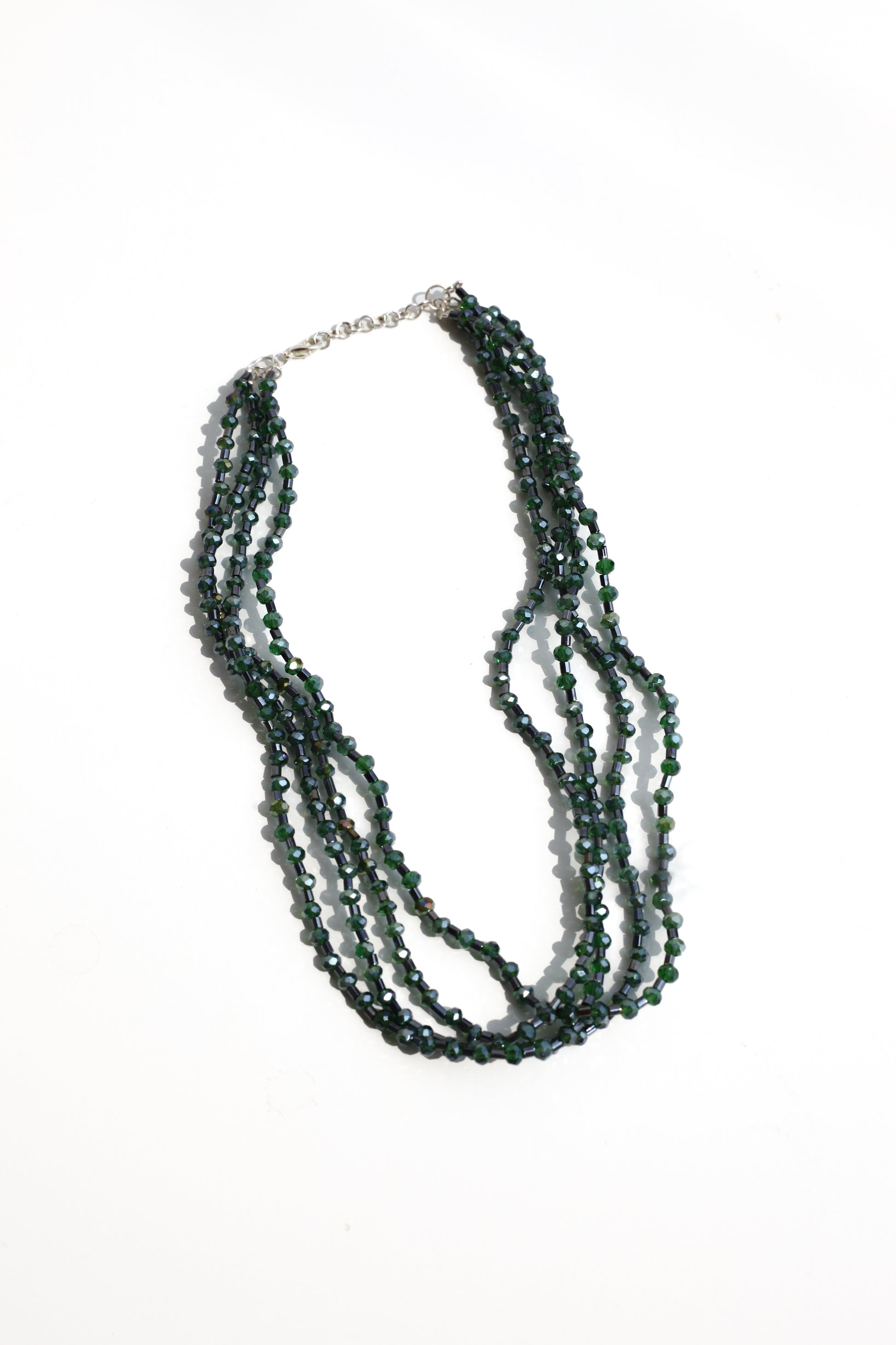 Multistrand beaded necklace on a white background