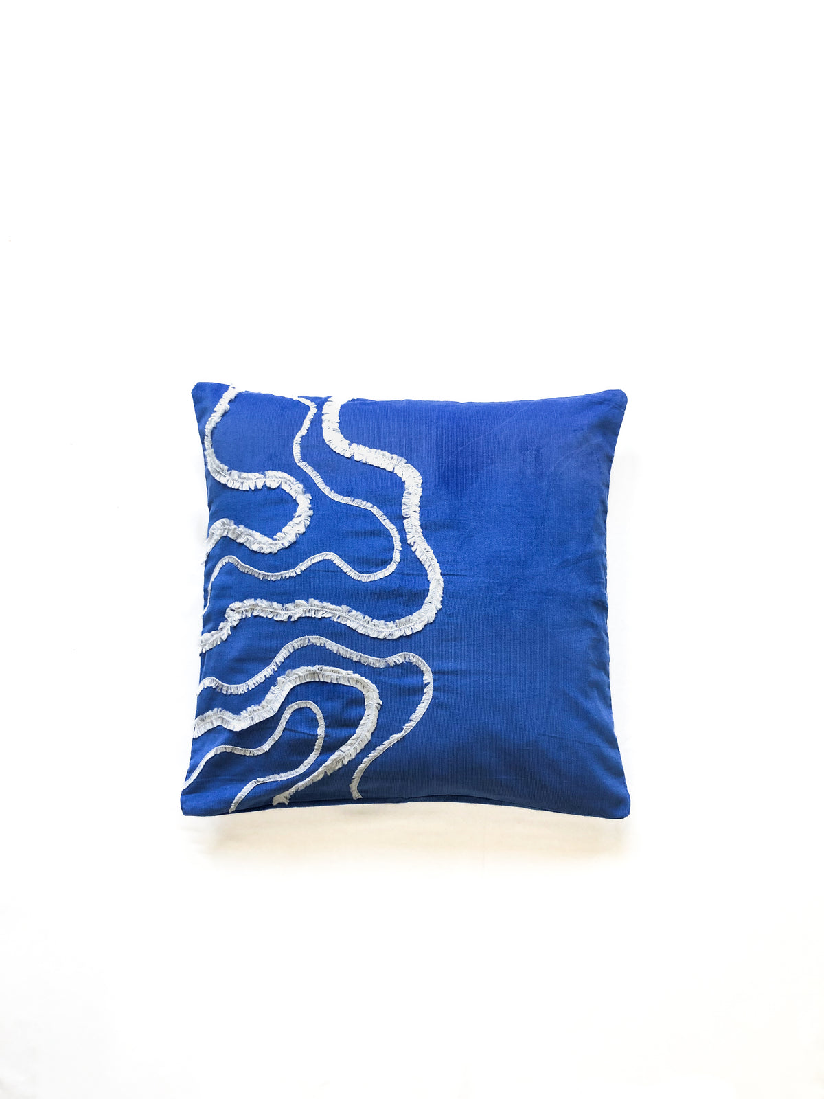 Cobalt blue cotton cushion cover with white textured wave embroidery, inspired by ocean waves. This modern, handcrafted cushion is perfect for coastal, boho, or minimalist home décor. Ideal for sofas, beds, and lounge spaces, adding a stylish and elegant touch.