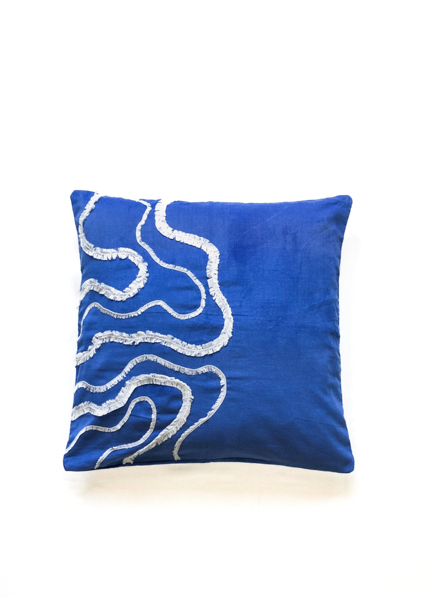 Cobalt blue cotton cushion cover with white textured wave embroidery, inspired by ocean waves. This modern, handcrafted cushion is perfect for coastal, boho, or minimalist home décor. Ideal for sofas, beds, and lounge spaces, adding a stylish and elegant touch.