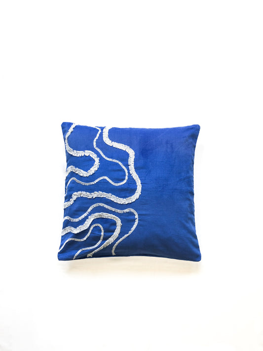 Cobalt blue cotton cushion cover with white textured wave embroidery, inspired by ocean waves. This modern, handcrafted cushion is perfect for coastal, boho, or minimalist home décor. Ideal for sofas, beds, and lounge spaces, adding a stylish and elegant touch.