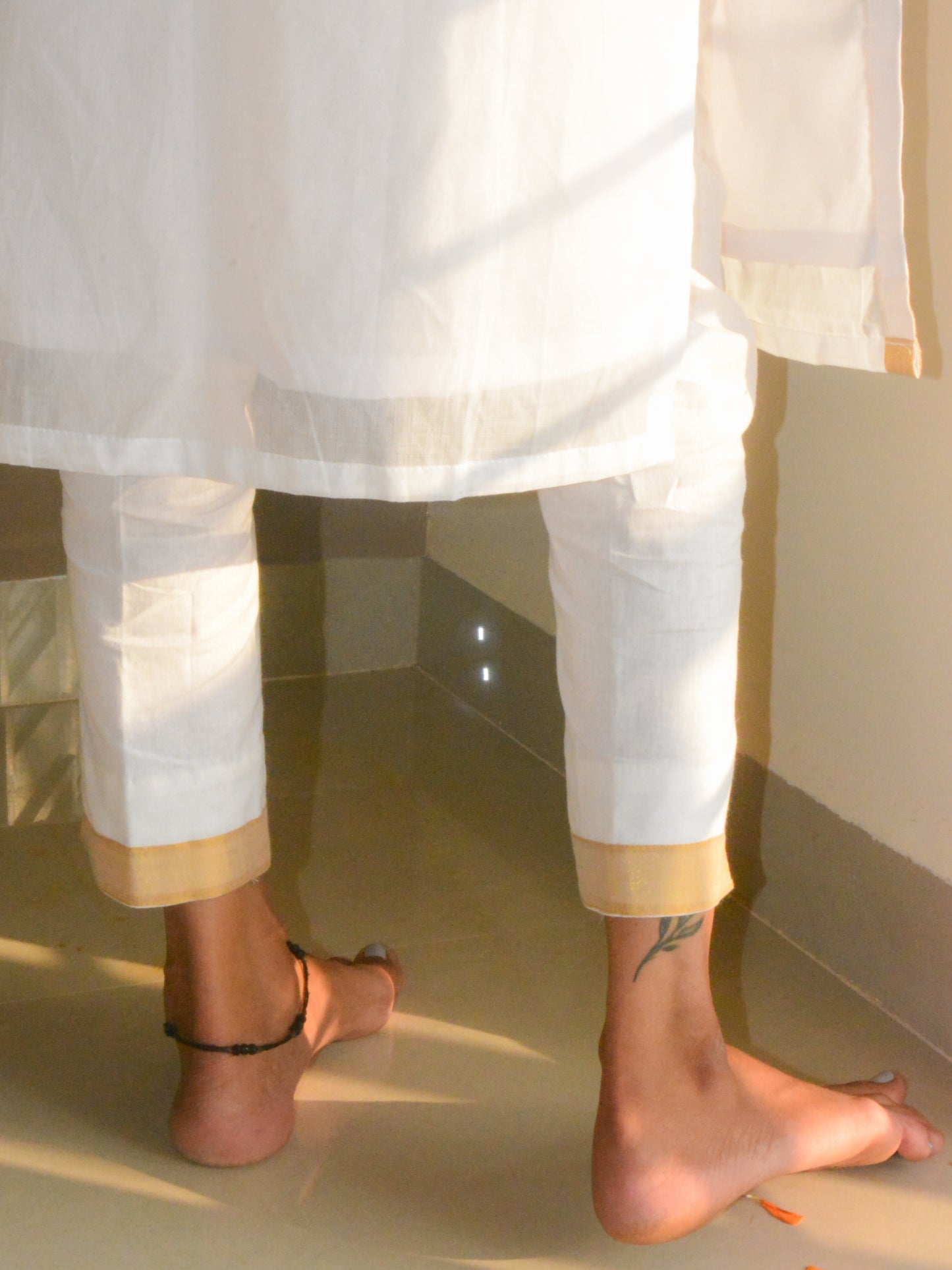 Close-up of the pure white cotton pants of the Ila Tunic.