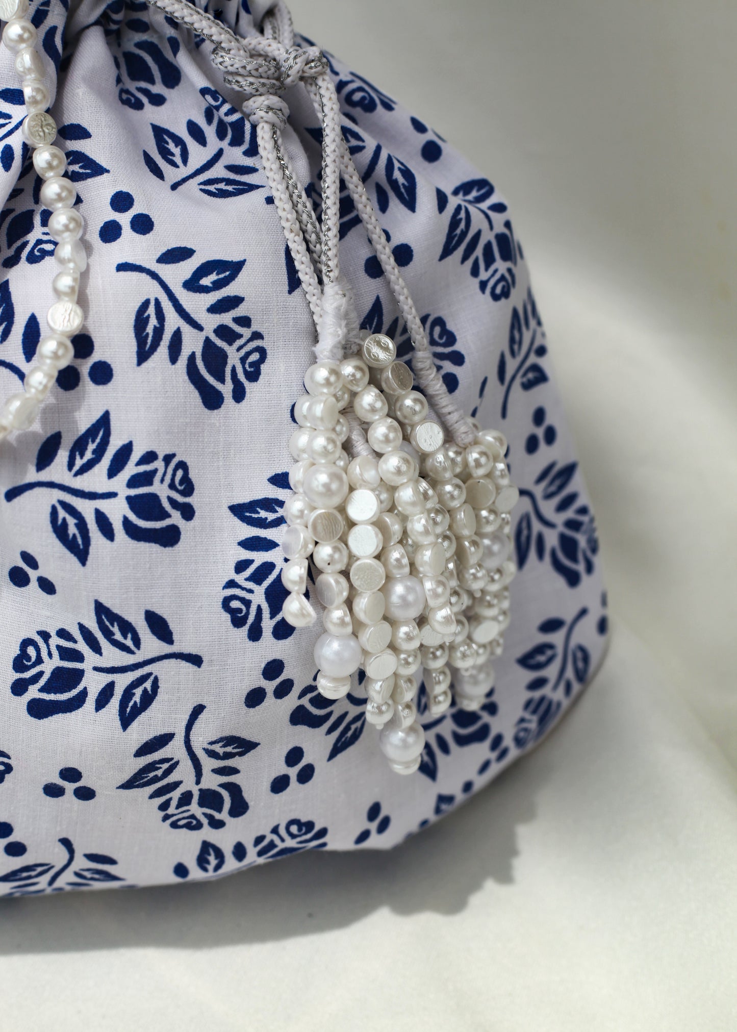 Closeup of pearl tassels tie-up of drawstring bag