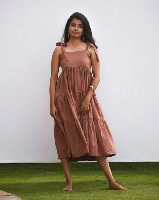 Cotton-Linen tiered midi dress in brown colour featuring tie-shoulders.